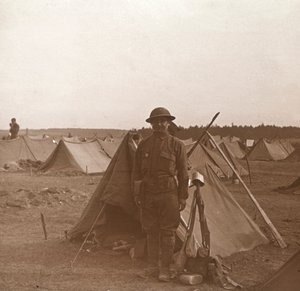 Soldier standing by tent, American camp, Melette, France by Unbekannt