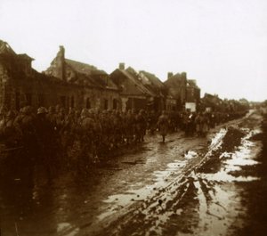 Soldiers Marching Past Bombed-Out Houses, Champagne, Northern France by Unbekannt