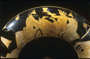 Symposium scene on red figure Attic kylix, wine cup, 5th century BC.