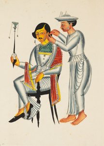 Young Bengali having his ears pierced