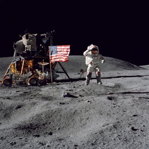 Astronaut John W. Young salutes the United States flag during Apollo 16 mission