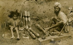 Carpenter and child working on bed legs by Unbekannter Künstler