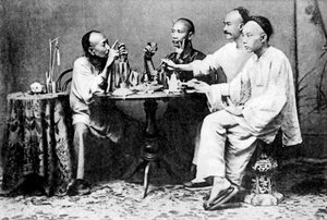 Group of men seated at table by Unbekannter Künstler