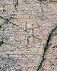 Human figures, rock carvings in the Naquane National Rock Art Park by William M. Timlin