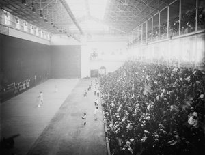 Jai alai is a sport involving a ball bounced off a walled space by accelerating it to high speeds with a hand-held device (cesta)