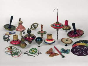 Spinning tops, humming tops and optical tops