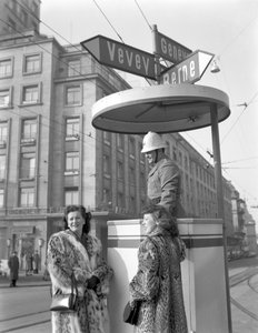 Two American young women talking to a policeman in Lausanne, 4th January 1949: With The Policeman