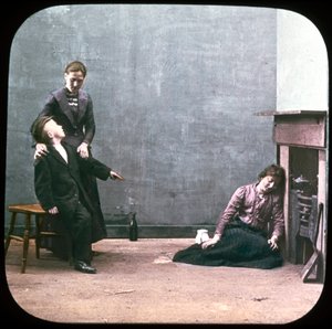 Two Women and Boy in Front of Fireplace, c. 1895 by Unbekannt