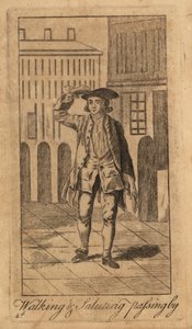 Young gentleman walking and saluting passerby on the street