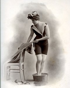 Young woman in a swimsuit taking a foot bath, around 1900 by Unbekannter Künstler