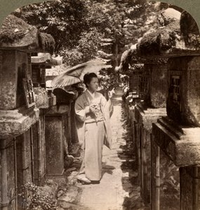 A Woman Shinto Devotee Counting the Stone Lanterns, Kasuga Shrine, Nara, Japan