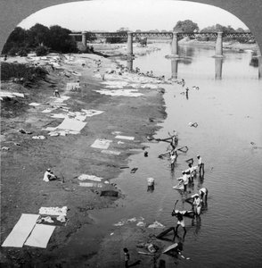 Dhobis Washing Clothes in the Gomti River, Near Lucknow, India, 1900s by Underwood and Underwood