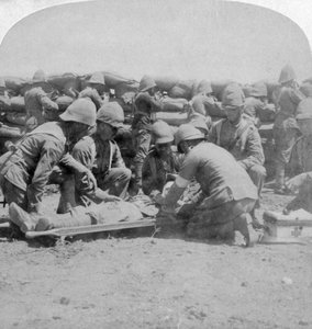 First Aid to a Wounded Fusilier, Honey Nest Kloof Battle, Boer War, South Africa by Underwood and Underwood