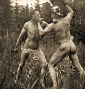 Fighting battle pose with a Roman Helmet, c.1910 by Unknown