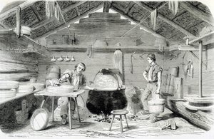 Making Gruyère cheese in a Swiss chalet, or cheese factory in the Alps - in 