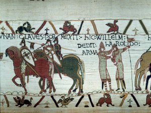 The conquest of Brittany by the Duke of Normandy William the Conqueror: on the left the duke receives the keys of the city of Dinan, on the right he makes a knight Harold, sent by the English king Edward the Confessor (detail of the tapestry)