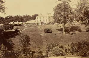 [Country House with a Greenhouse and Lawn]