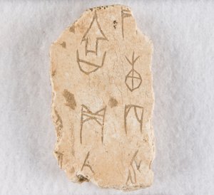 Inscribed bone fragment ("oracle bone") by Unknown artist