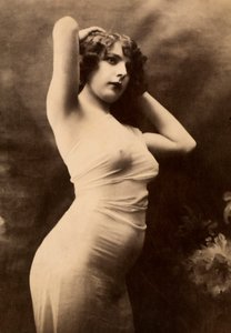 Half-length portrait in profile of a young woman in transparent attire by Unknown photographer