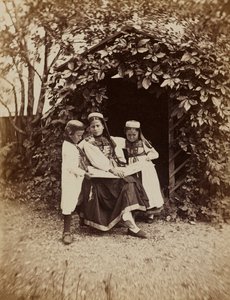 La Foret Noire: Portrait of a Woman with Two Children in Traditional Dress of the Black Forest by Unknown photographer