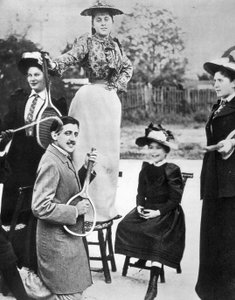 Marcel Proust, in the Midst of a Group of Young Women, Playing Guitar on a Tennis Racket at Bineau Boulevard in Paris by Unknown photographer