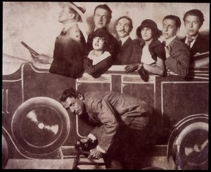 Max Morise, Simone Breton, Paul Eluard, Joseph Delteil, Gala Desnos, Andre Breton, and Max Ernst at the Foire de Montmartre