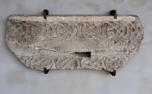 Stone with inscription and decorations