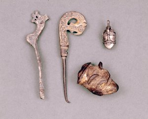 Various pieces of apparatus and Viking jewels, with a representation of the deity Odin. Stockholm, Historiska Museet