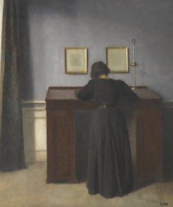 Ida Standing at a Desk by Vilhelm Hammershøi