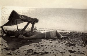 Two Women Lying on the Sea Shore in the Shade of a Towel. Postcard Sent by the Photographer to Vincenzo Balocchi by Vincenzo Balocchi