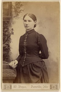 Unidentified woman, standing
