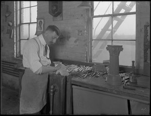 Carver working on casket ornaments, Oneida, New York, April 3, 1916 by William Davis Hassler