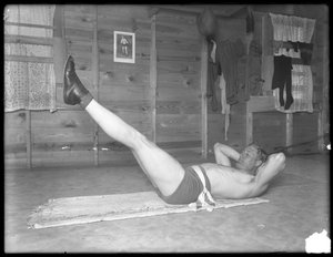 English Boxer William Thomas Wells (Bombardier Billy Wells), Posing in Training Togs Doing Leg Lifts