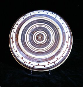 Charger with concentric circles of white, blue, purple and gold lustre