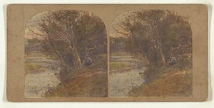 Man in pensive mood seated at riverbank