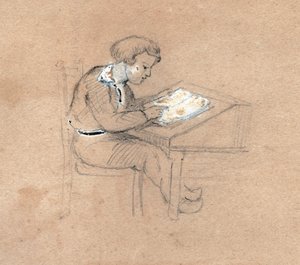 Schoolboy at work on his desk