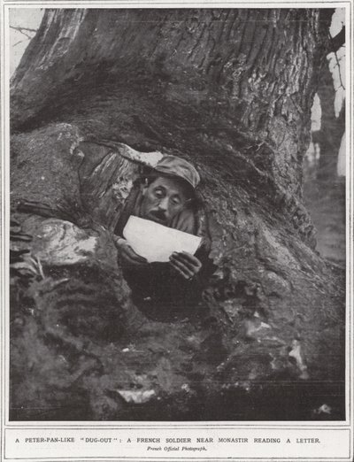 A Peter-Pan-like "dug-out", a French soldier near Monastir reading a letter by (after) English photographer
