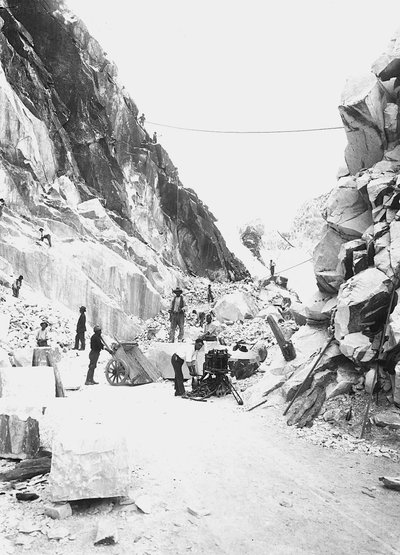 Excavators at work at a marble quarry in the Apuan Alps, Tuscany by A. Corsini