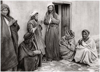 A Mullah Teaching a Prayer to a Young Man, Iraq, 1925 by A. Kerim