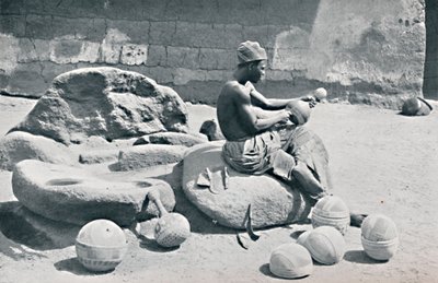 A Yoruba Man Engraving Clay Bowls and Water Jars, Lagos Hinterland, Southern Nigeria, 1912 by A. W. Gelston