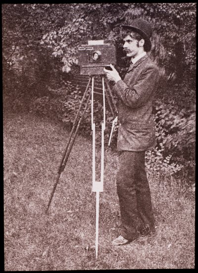 Self portrait with camera, tripod and pistol by Alfred Stieglitz