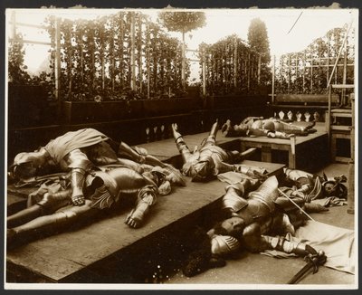 Six Male Models as Ancient Warriors Dressed in Armor Pretending to be Dead by Alphonse Maria Mucha