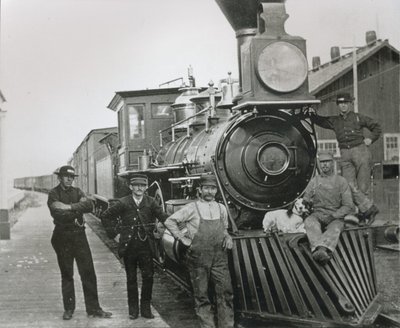 A freight train of the Central Pacific railway with crew at Mill City, Nevada by American Photographer