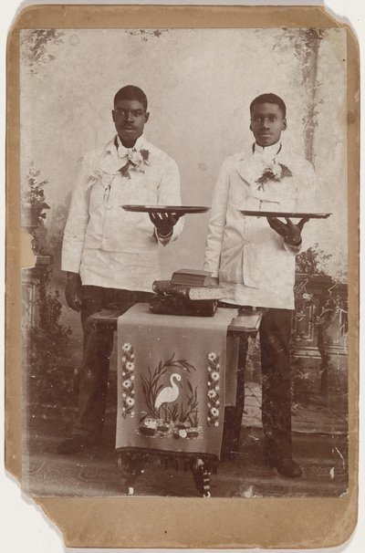 Portrait of Two Men Holding Trays by American Photographer