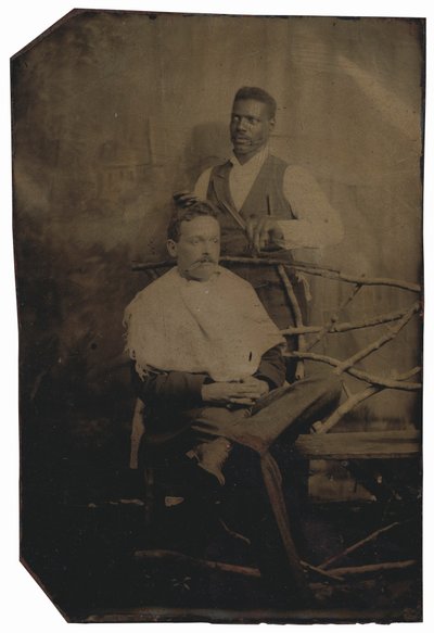 Portrait of a Man Cutting Hair by American Photographer