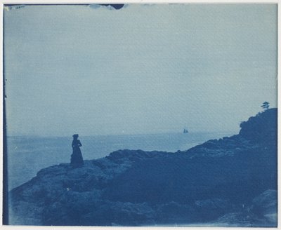 Woman Watching Schooner from a Rocky Promontory by American Photographer