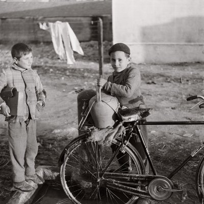 Child Water Carrier on Bicycle by Ando Gilardi