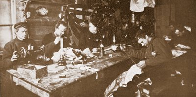 In the Hut during Mid-Winter, the Men Engaged in Sewing Furs for Clothing to be Used in Springtime Sledging, pub. London 1907 by Anthony Fiala