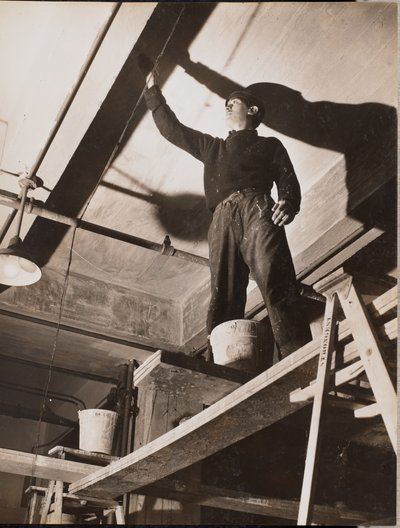 Man standing on wooden scaffolding painting a ceiling by Arnold Eagle