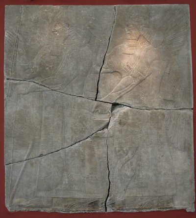 King Ashurnasirpal II and his God. Relief from the palace of Ashurnasirpal II at Kalhu, Nimrud by Assyrian